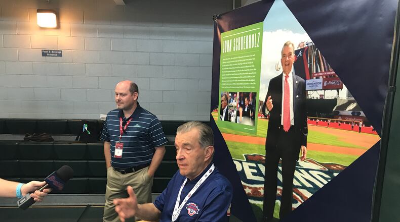 John Schuerholz, in both foreground and background. (M. Bradley)