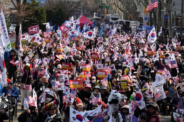 Supporters of impeached South Korean President Yoon Suk Yeol stage a rally to oppose his impeachment near the Constitutional Court in Seoul, South Korea, Tuesday, April 1, 2025. The letters read "Yoon Suk Yeol's immediate return and dismiss impeachment." (AP Photo/Ahn Young-joon)