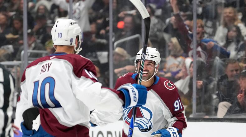 Colorado Avalanche center Nazem Kadri, right, celebrates his goal with center Nicolas Roy during the first period of Game 3 in the first round of the NHL hockey Stanley Cup playoffs against the Los Angeles Kings, Thursday, April 23, 2026, in Los Angeles. (AP Photo/Mark J. Terrill)