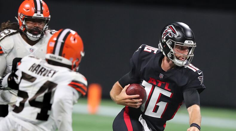 082921 Atlanta: Atlanta Falcons backup quarterback Josh Rosen avoids the pressure from Cleveland Browns defenders breaking loose for yardage during the second half in a NFL preseason football game on Sunday, August 29, 2021, in Atlanta.   “Curtis Compton / Curtis.Compton@ajc.com”