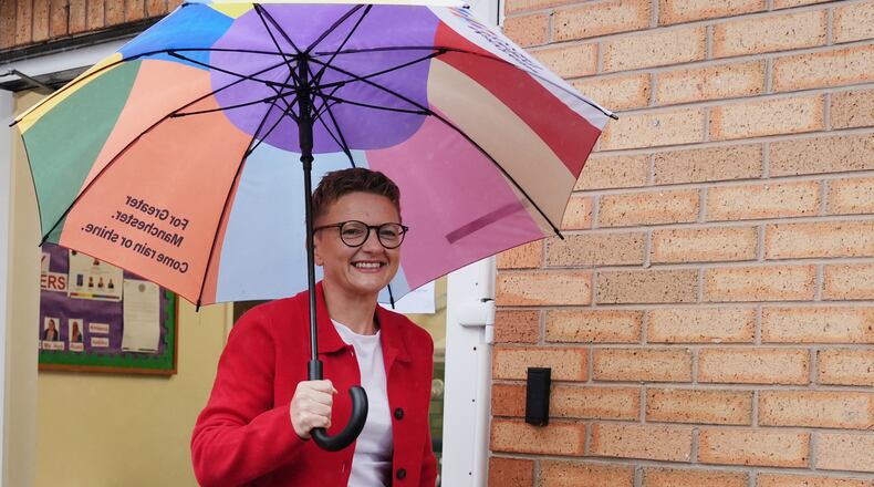 Bev Craig, the Labour Party candidate, departs Broad Oak Primary in Didsbury after voting in the Greater Manchester mayoral by-election, in Manchester, England, Thursday July 30, 2026. (Annabelle Lee-Ellis/PA via AP)