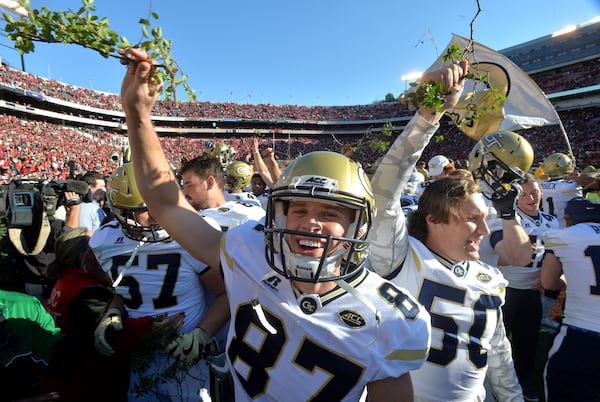 November 26, 2016 Athens - Georgia Tech place kicker Harrison Butker (87) and other players celebrate their 28-27 win over Georgia with a piece of the Sanford Stadium hedges at Sanford Stadium on Saturday, November 26, 2016. HYOSUB SHIN / HSHIN@AJC.COM