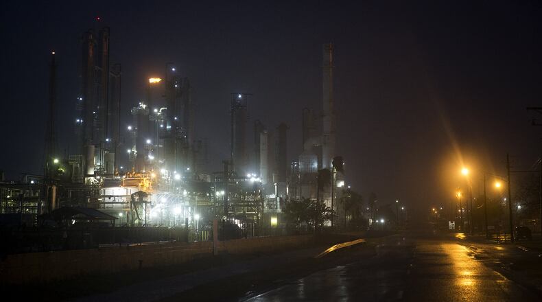 A Valero oil refinery’s flare continues to burn as Hurricane Harvey makes landfall in Corpus Christi Friday. Hurricane Harvey smashed into Texas late Friday, lashing a wide swath of the Gulf Coast with strong winds and torrential rain from the fiercest hurricane to hit the U.S. in more than a decade. NICK WAGNER/AUSTIN AMERICAN-STATESMAN