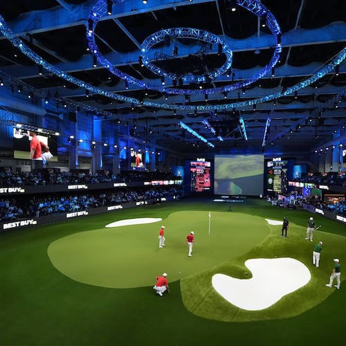 FILE - Fans watch play during a match of the TMRW Golf League (TGL) between Jupiter Links Golf Club and Boston Common Golf, Jan. 27, 2025, in Palm Beach Gardens, Fla. (AP Photo/Rebecca Blackwell, File)