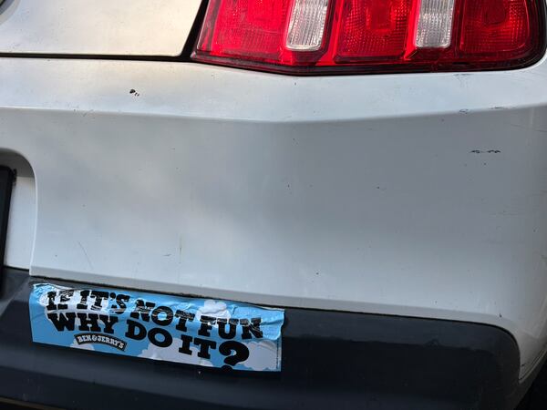 A bumper sticker reads, "If it's not fun why do it?" on the back of 100-year-old Barbara Haig's Ford Mustang convertible. (Doug Turnbull for the AJC)