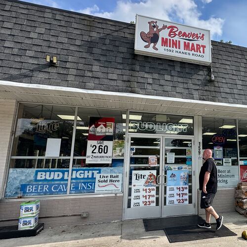 A customer walks into Beaver's Mini Mart in Beavercreek, Ohio, Friday, Aug. 14, 2026. (AP Photo/Julie Carr Smyth)
