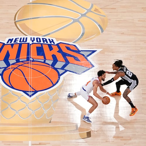 FILE - New York Knicks guard Landry Shamet (44) brings the ball up the court against San Antonio Spurs guard Devin Vassell (24) during the second half of Game 3 of the NBA Finals basketball series, June 8, 2026, in New York. (AP Photo/Yuki Iwamura, File)