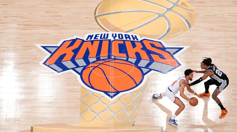 FILE - New York Knicks guard Landry Shamet (44) brings the ball up the court against San Antonio Spurs guard Devin Vassell (24) during the second half of Game 3 of the NBA Finals basketball series, June 8, 2026, in New York. (AP Photo/Yuki Iwamura, File)