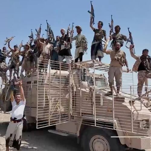 This image taken from undated video released by the Houthi-run Al-Masirah television channel on Saturday, Sept. 12, 2026, shows Houthi fighters chanting and raising rifles atop a military vehicle in Dhubab district, Taiz province, Yemen, according to the channel. (Al-Masirah TV via AP)