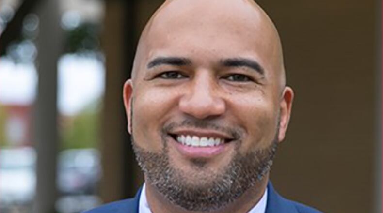 A Black high school principal from Texas was ordered by district administrators to remove a photo from Facebook that showed him kissing his white wife on their anniversary to avoid stirring up controversy among parents who complained.