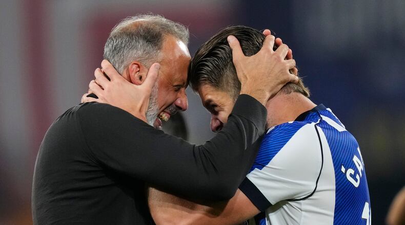 Real Sociedad's head coach Pellegrino Matarazzo, right, celebrates with Duje Caleta-Car after winning the Copa del Rey final soccer match between Atletico Madrid and Real Sociedad in Seville, Spain, Saturday, April. 18, 2026. (AP Photo/Jose Breton)