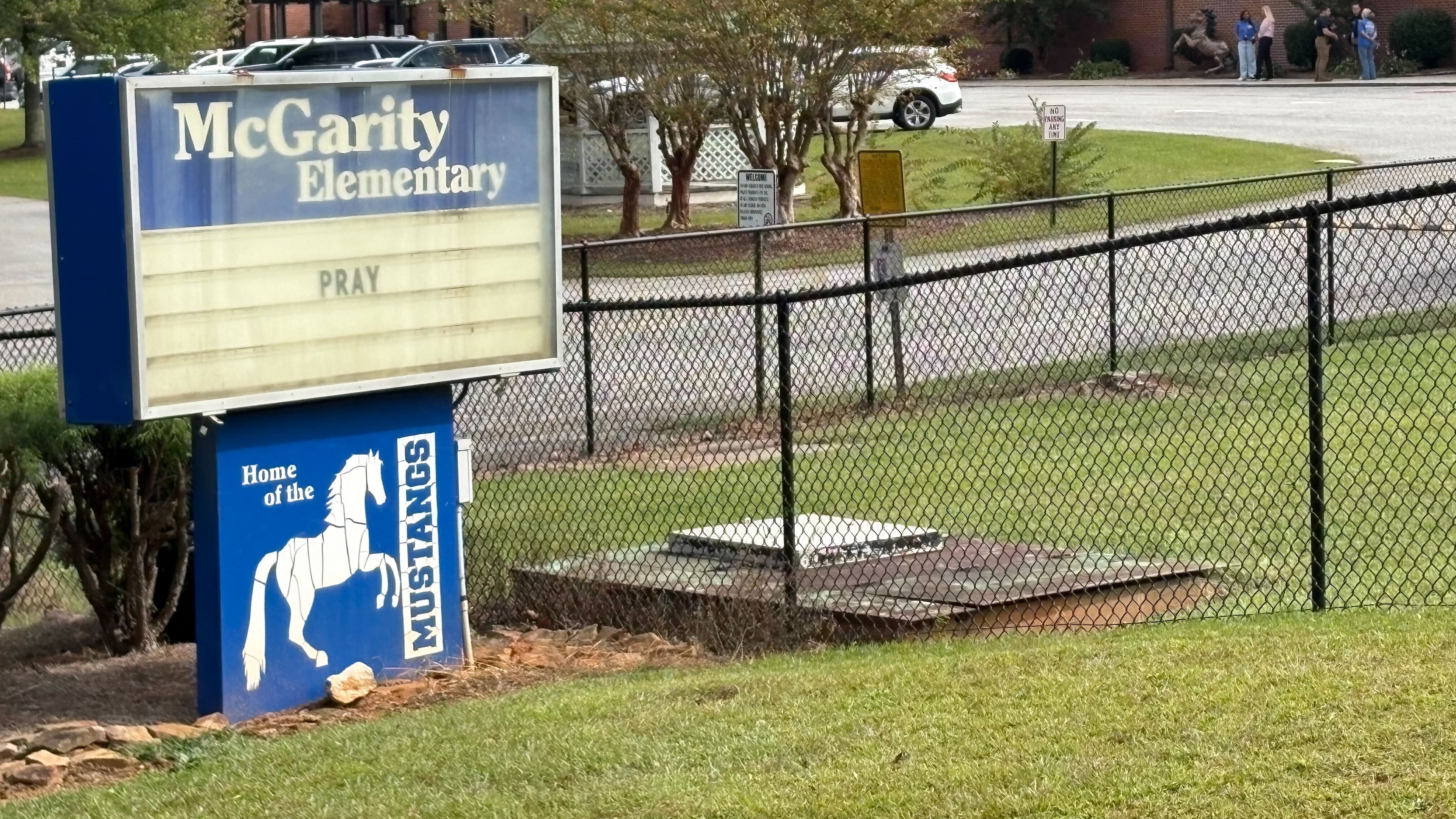 Outside of McGarity Elementary School, the marquee sign simply reads "Pray." A student, 6, was found unresponsive in a pool near a residence at Carlton Farms in Polk County. She was taken to a hospital where she died. (Arvin Temkar/AJC)