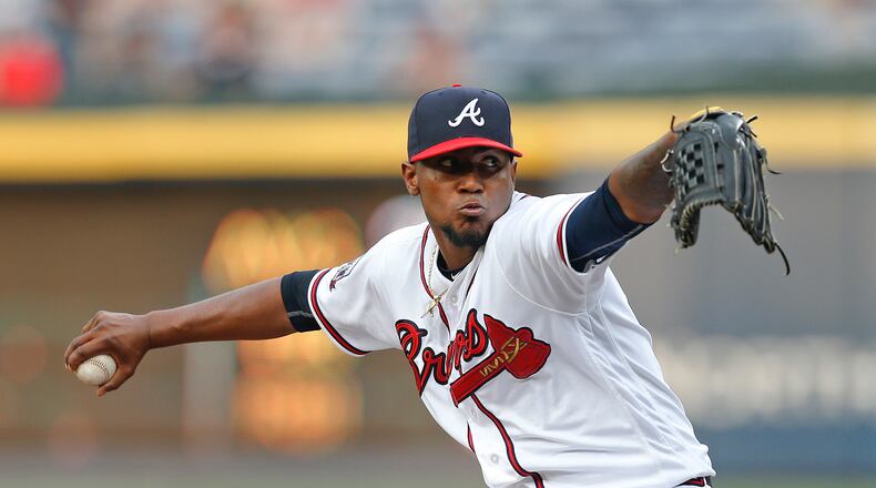 Atlanta Braves starting pitcher Julio Teheran works in the first inning of a baseball game against the Los Angeles Dodgers on Wednesday, April 20, 2016, in Atlanta . (AP Photo/John Bazemore)