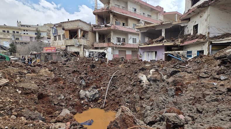 A huge crater left by an Israeli airstrike in the village of Nabi Chit, eastern Lebanon late Friday, March 6, 2026, where Israeli forces landed overnight and dug a grave in a cemetery searching for Israeli co-pilot Ron Arad who was captured and then went missing after his fighter jet crashed over south Lebanon in 1986. (AP Photo/Ali Salem)