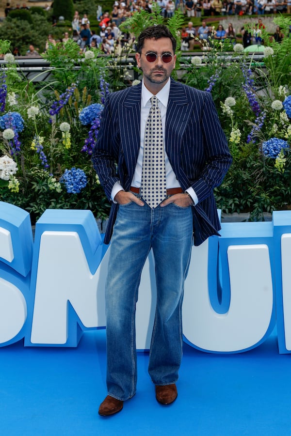 Dan Levy poses for photographers upon arrival at the world premiere of the film "Smurfs", on Saturday, June 28, 2025, in Brussels. (AP Photo/Omar Havana).