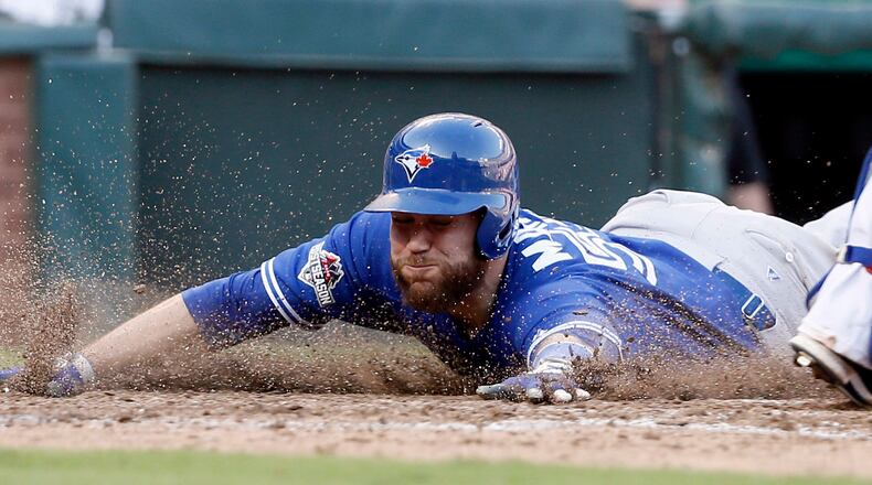 Toronto Blue Jays catcher Russell Martin (55) scores against the Texas Rangers during the seventh inning at Game 4 of baseball's American League Division Series Monday, Oct. 12, 2015, in Arlington, Texas. (AP Photo/Tony Gutierrez)
