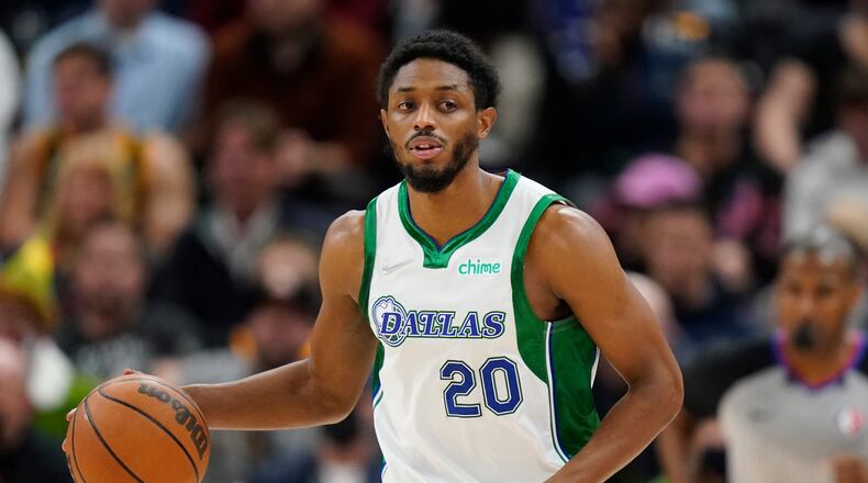FILE - Dallas Mavericks guard Brandon Knight (20) brings the ball up court in the second half during an NBA basketball game against the Utah Jazz Saturday, Dec. 25, 2021, in Salt Lake City. (AP Photo/Rick Bowmer, File)