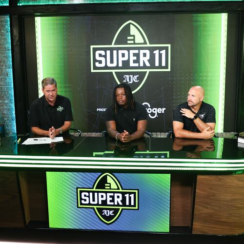 DawgNation’s Brandon Adams interviews Kell’s Quinterrius “Moonie” Gipson and coach Bobby May during the taping of the Super 11 reveal show at Score ATL in Roswell on Aug. 3, 2026. (Arvin Temkar/AJC)