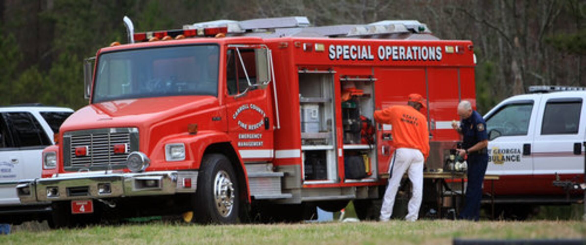 Crews search Carrollton crash site