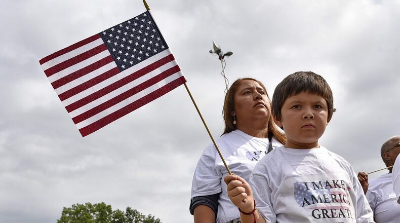 ActionNC hispanic supporters speak during a rally at the TD Convention Center where Rep. presidential candidate Donald Trump was due to speak August, 27, 2015, in Greenville, S.C. (AP Photo/Richard Shiro)