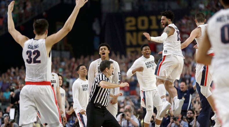 Gonzaga players celebrate after the semifinals of the Final Four NCAA college basketball tournament against South Carolina, Saturday, April 1, 2017, in Glendale, Ariz. Gonzaga won 77-73. (AP Photo/David J. Phillip)