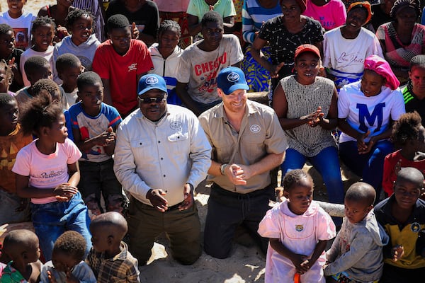 Britain's Prince Harry attends a safety class for children as part of his visit to see the work of landmine clearance charity of the Halo Trust, in Cuito Cuanavale, Cuando province, southern Angola, Wednesday, July 16, 2025. (Ampe Pedro/The Halo Trust via AP)