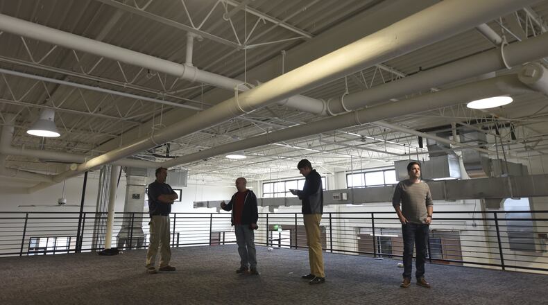 November 14, 2016, Atlanta - From left, David Tafelski, Scott McManus, Jim Boatright and Josh Teague, stand in the future office space of tech company FullStory in Atlanta, on Monday, November 14, 2016. (DAVID BARNES / DAVID.BARNES@AJC.COM)
