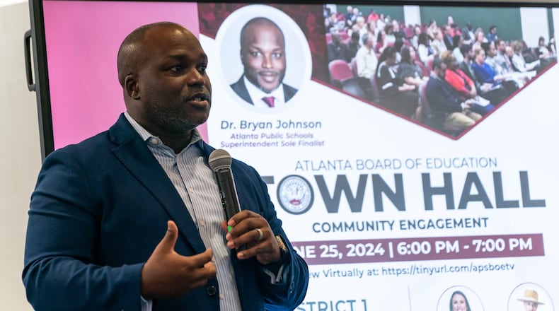 Bryan Johnson, the sole finalist for superintendent of Atlanta Public Schools, speaks to community members at The New Schools at Carver in Atlanta on Tuesday, June 25, 2024. (Seeger Gray / AJC)
