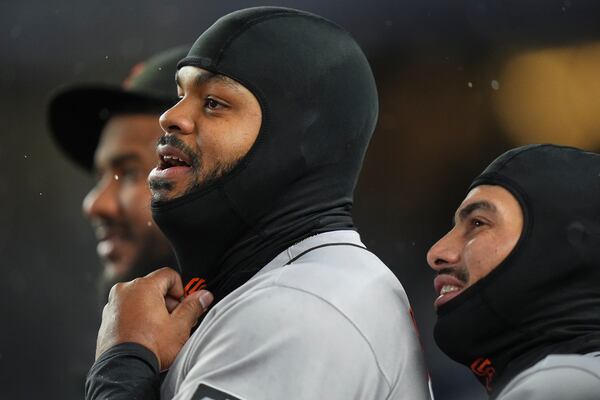 San Francisco Giants' Heliot Ramos, left, and Willy Adames watch during the first inning of a baseball game against the New York Yankees Friday, April 11, 2025, in New York. (AP Photo/Frank Franklin II)