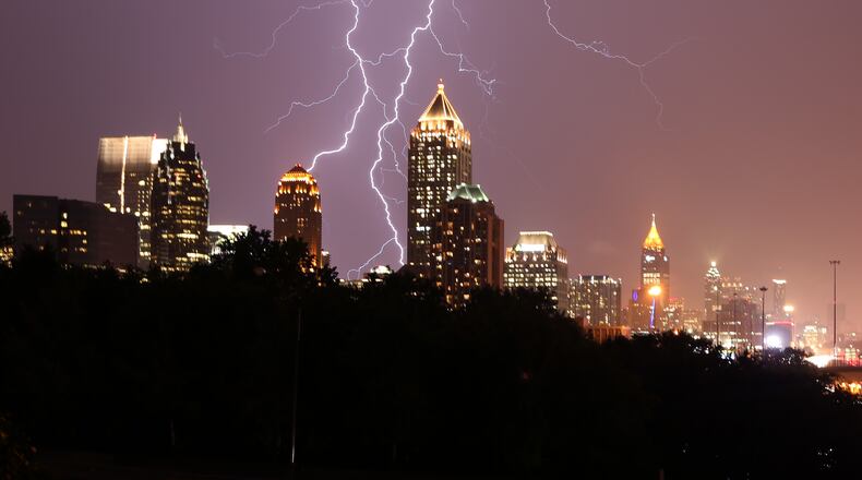 July 14, 2015 Atlanta: Lightning lights up the Midtown sky Tuesday evening July 14, 2015. Ben Gray / bgray@ajc.com