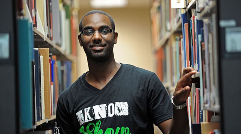 Jason Caine, who is working on a Master of Divinity and a master's in counseling at Mercer University, says he often procrastinates doing his course work. He is shown here at the Mercer University library in Chamblee Thursday, Aug. 30, 2012.