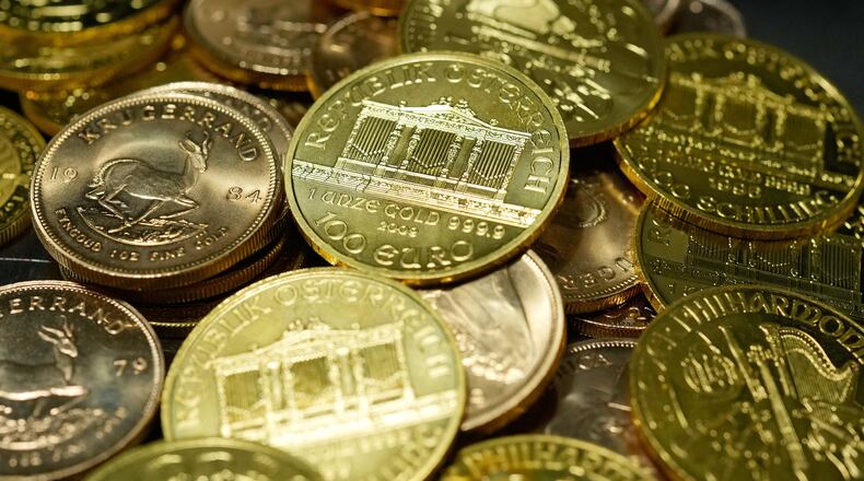 FILE - 1 Ounce Fine Gold Coins are displayed in the safe deposit boxes room at the Pro Aurum gold house in Munich, Germany, Friday, April 25, 2025. (AP Photo/Matthias Schrader, File)