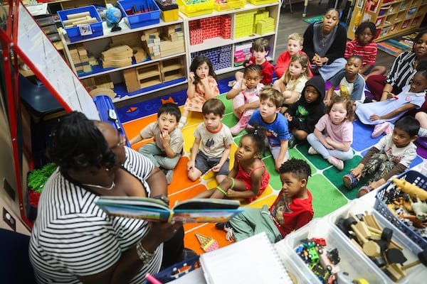 Assistant Lead Teacher Yolanda Maheia reads to her pre-K class at the Capitol Hill Child Enrichment Center in Atlanta on Wednesday, April 22, 2026. (Abbey Cutrer/AJC)