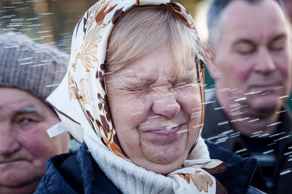 A women is blessed by a priest during celebration of the Orthodox Easter in Krasne village, Ukraine, on Sunday, April 20, 2025. (AP Photo/Evgeniy Maloletka)