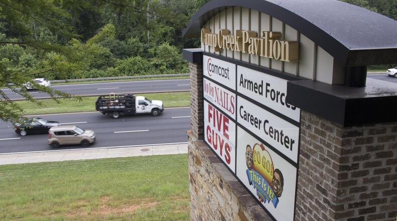 Traffic on Camp Creek Parkway flows past the Camp Creek Marketplace where Atlanta and East Point police are working to stem a rash of car break-ins. (Jenna Eason / Jenna.Eason@coxinc.com)