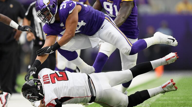 Kendricks of the Minnesota Vikings pushes quarterback Matt Ryan  of the Atlanta Falcons out of bounds (Photo by Hannah Foslien/Getty Images)