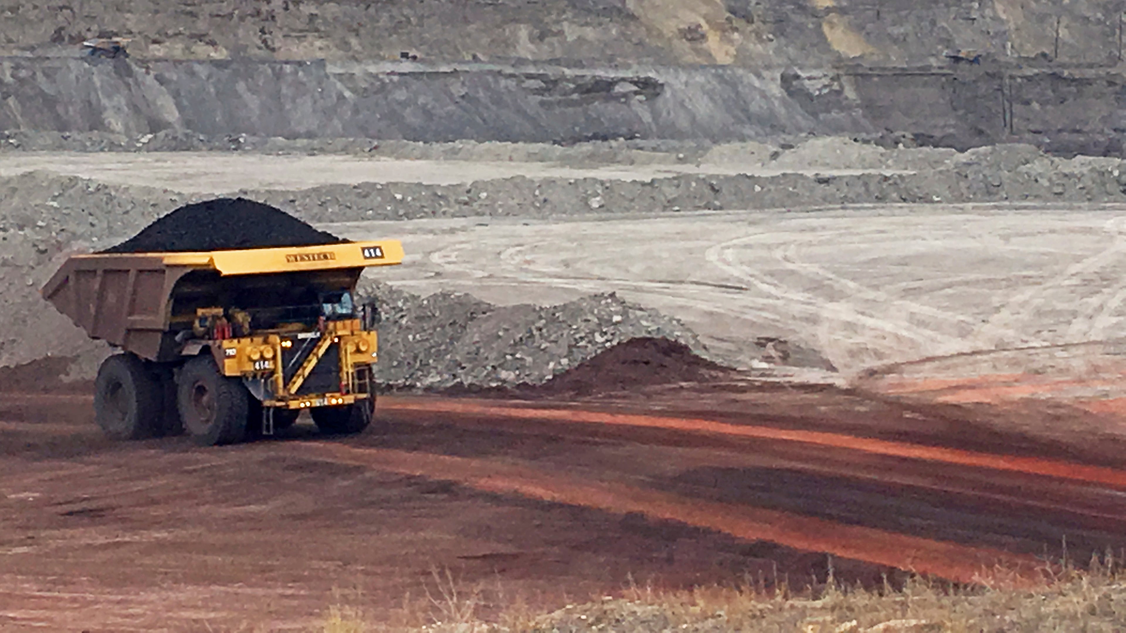 FILE - A dump truck hauls coal at the Eagle Butte Mine, now owned by Eagle Specialty Materials, LLC, near Gillette, Wyo., March 28, 2017. (AP Photo/Mead Gruver, File)