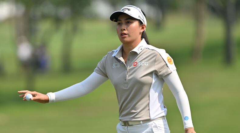 Jeeno Thitikul of Thailand reacts after putting on the first hole during the first round of the LPGA Honda Thailand golf tournament in Pattaya, Thailand, Thursday, Feb. 19, 2026. (AP Photo/Kittinun Rodsupan)