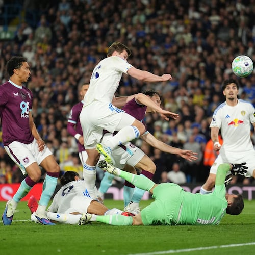 Leeds United's Dominic Calvert-Lewin, second from left, scores their side's third goal during the Premier League match between Leeds United and Burnley, in Leeds, England, Friday, May 1, 2026. (Martin Rickett/PA via AP)