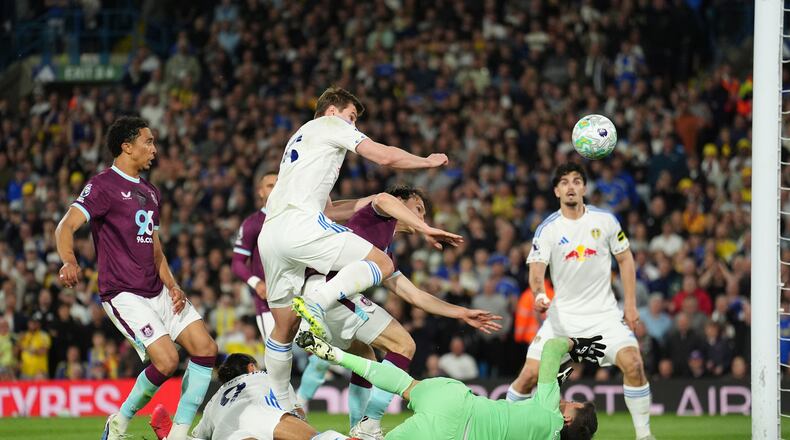 Leeds United's Dominic Calvert-Lewin, second from left, scores their side's third goal during the Premier League match between Leeds United and Burnley, in Leeds, England, Friday, May 1, 2026. (Martin Rickett/PA via AP)