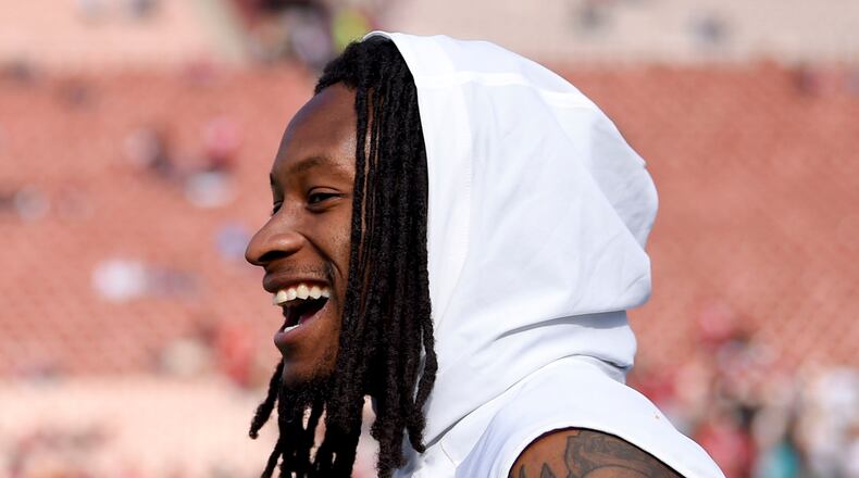 Los Angeles Rams running back Todd Gurley smiles on the sidelines before an NFL football game against the San Francisco 49ers Sunday, Dec. 31, 2017, in Los Angeles. (AP Photo/Mark J. Terrill)
