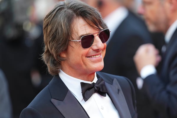 Tom Cruise poses for photographers upon arrival at the premiere of the film 'Mission: Impossible - The Final Reckoning' at the 78th international film festival, Cannes, southern France, Wednesday, May 14, 2025. (Photo by Lewis Joly/Invision/AP)