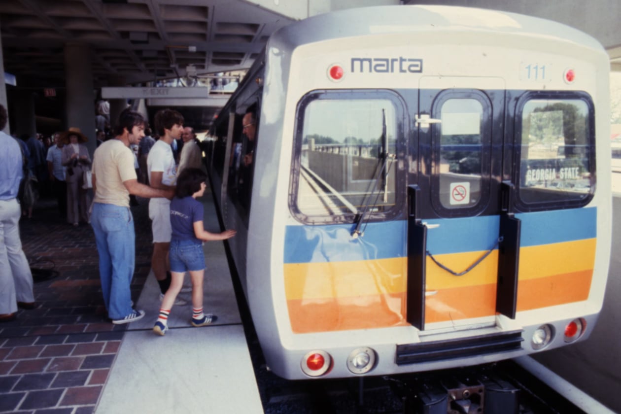 Passengers board the first MARTA train ride during the opening ceremonies of the East Lake Station in June 1979.