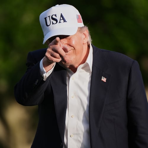 President Donald Trump gestures to reporters as he walks across the South Lawn of the White House, Friday, May 15, 2026, in Washington, on return from Beijing where he met with China's President Xi Jinping. (AP Photo/Jacquelyn Martin)