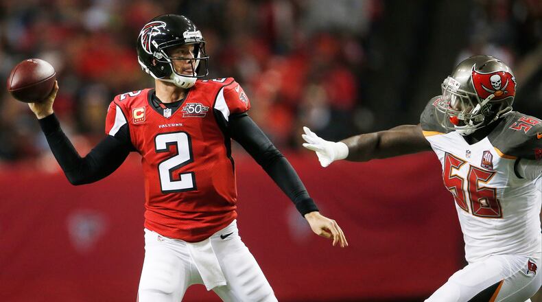 Atlanta Falcons quarterback Matt Ryan (2) works as Tampa Bay Buccaneers defensive end Jacquies Smith (56) gives chase during the second of an NFL football game, Sunday, Nov. 1, 2015, in Atlanta. (AP Photo/John Bazemore)