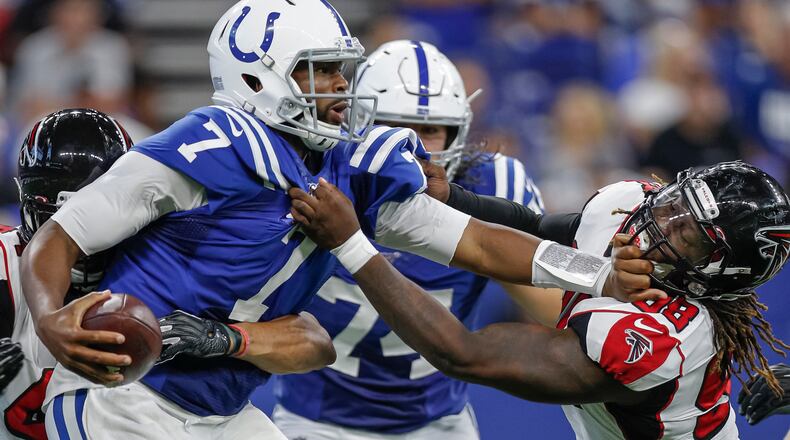 Falcons Takkarist McKinley (98) and Vic Beasley (44) close in on Colts quarterback Jacoby Brissett (7) for a sack during the second half Sept. 22, 2019, at Lucas Oil Stadium  in Indianapolis.