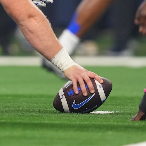 FILE - BYU prepares to snap the ball during the Big 12 Conference championship NCAA college football game between Texas Tech and BYU Saturday, Dec. 6, 2025, in Arlington, Texas. (AP Photo/Julio Cortez, File)