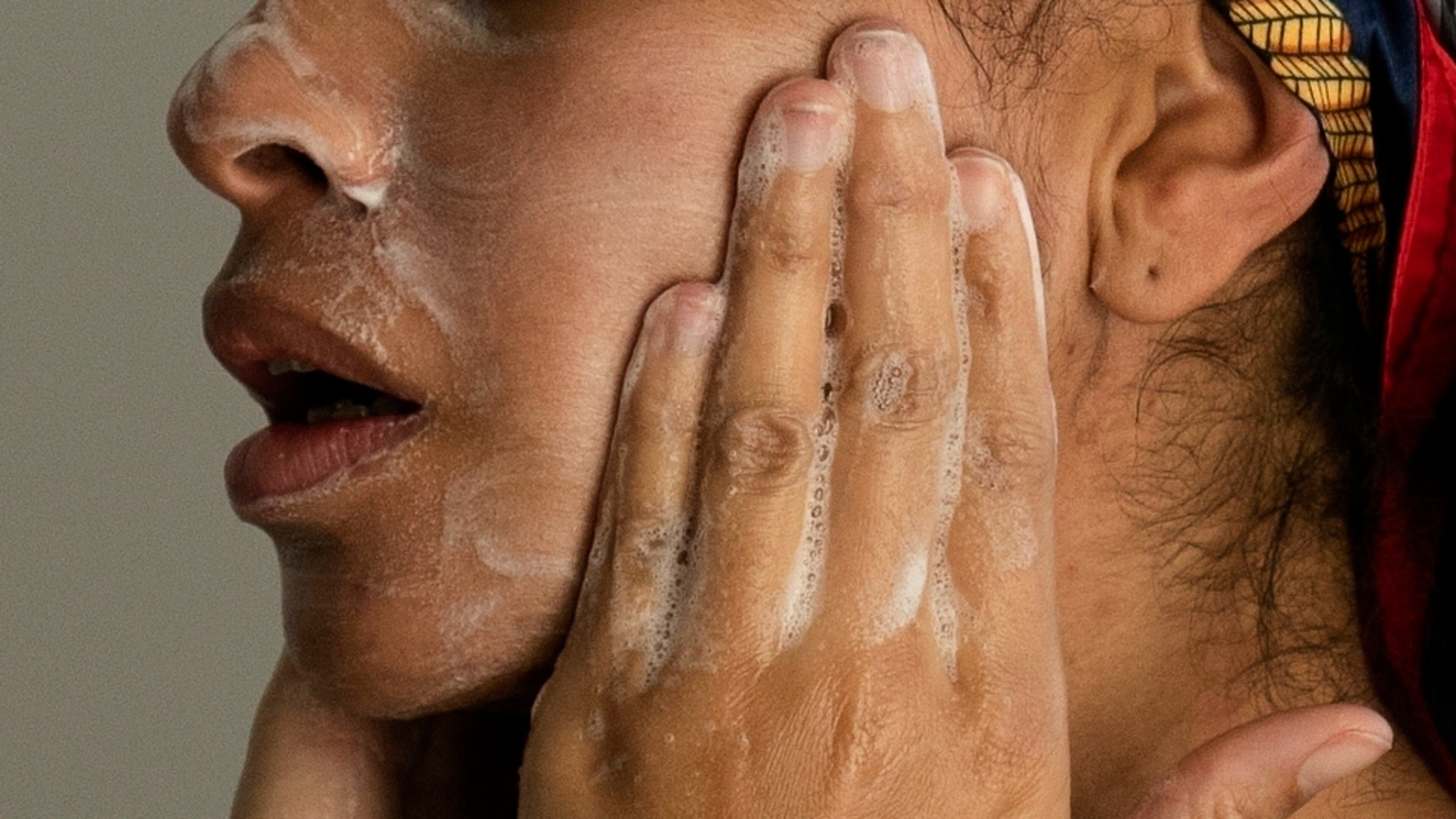 FILE - A woman washes her face as she prepares for work in Chicago, on Friday, Feb. 10, 2023. (AP Photo/Erin Hooley, File)