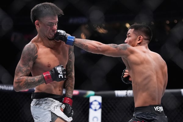 Joshua Van hits Brandon Royval in a flyweight fight at UFC 317, Saturday, June 28, 2025, in Las Vegas. (AP Photo/John Locher)