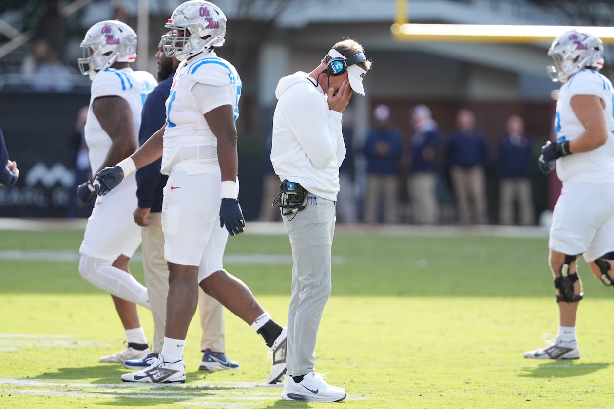 Mississippi head coach Lane Kiffin hangs his head as his players leave the field during their game against Mississippi State on Friday, Nov. 28, 2025, in Starkville, Miss. Kiffin took over the Ole Miss program before the 2020 season. (Rogelio V. Solis/AP)